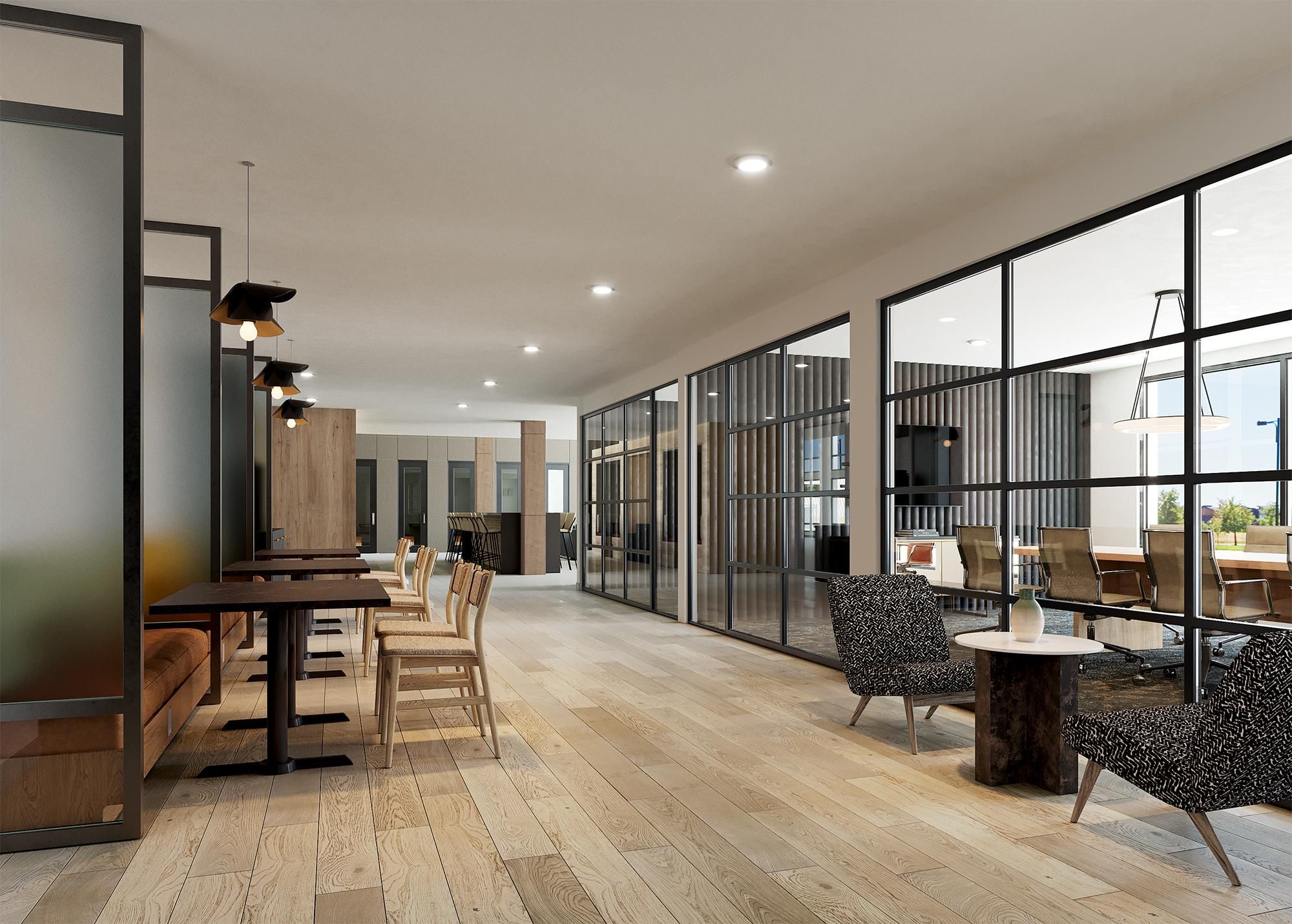 Co-working space at Solana Central Park with long wooden tables, contemporary seating, and large windows offering natural light.
