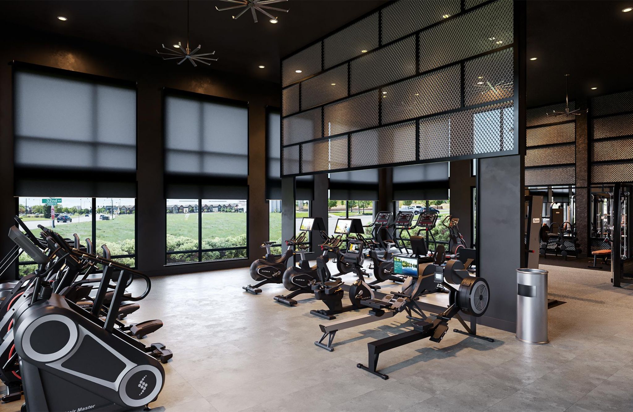 State-of-the-art gym at Solana Central Park featuring cardio machines and weights in a high-ceilinged room.